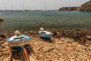 Sicily - Sunny impressions of the Aeolian Islands, also known as Aeolian Islands or Isole Eolie: Lipari, Stromboli, Salina, Vulcano, Panarea, Filicudi and Alicudi. Two fishing boats in Zimmari Bay, Panarea. Sicily - Sunny impressions of the Aeolian Islands, also known as Aeolian Islands or Isole Eolie: Lipari, Stromboli, Salina, Vulcano, Panarea, Filicudi and Alicudi. Two fishing boats in Zimmari Bay, Panarea.